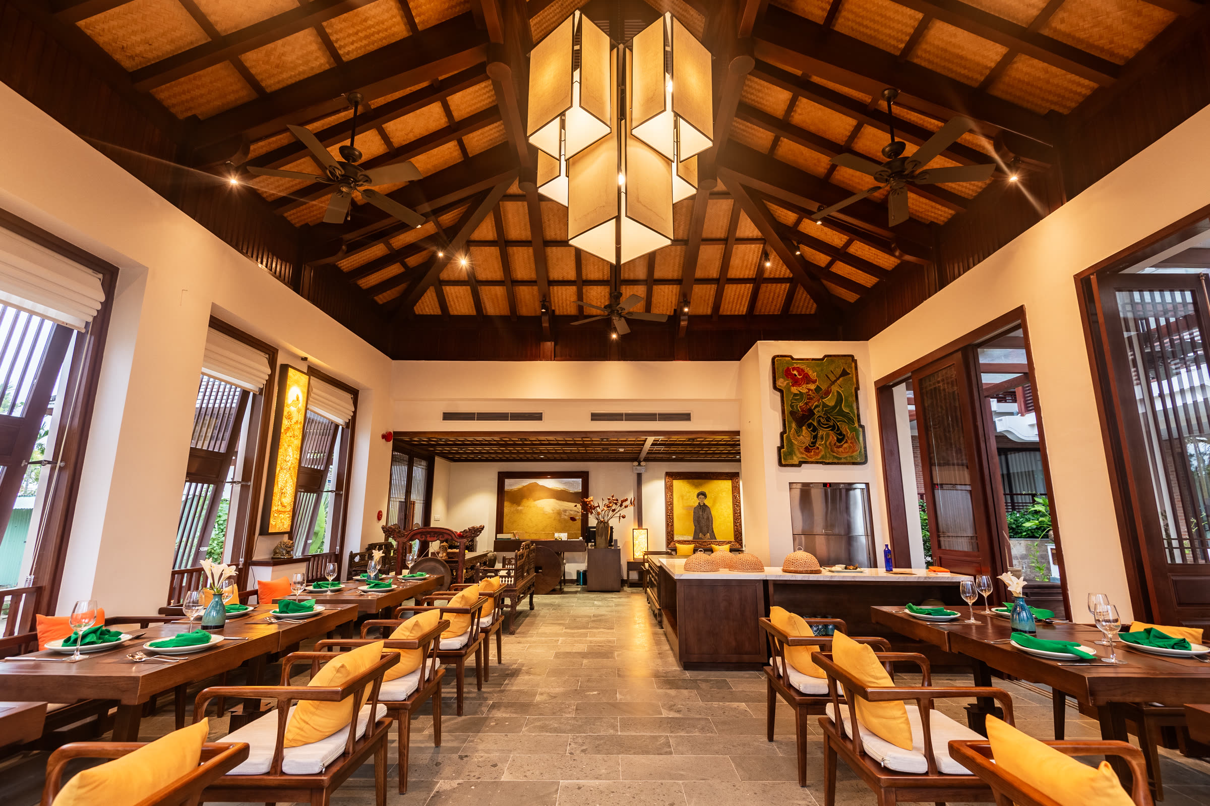 Paper lanterns hanging under the vaulted timber roof of the restaurant at Nghê Prana